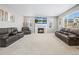 Inviting living room with a fireplace, large windows, and comfortable seating at 9716 Uravan St, Commerce City, CO 80022