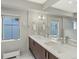 Bathroom with double sinks, modern fixtures, and ample counter space at 3538 Pecos St, Denver, CO 80211