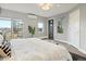 Bright and spacious bedroom featuring large windows, hardwood floors, and a modern design at 3538 Pecos St, Denver, CO 80211