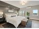 Bedroom with a large bed, a patterned rug, and views from multiple windows at 3538 Pecos St, Denver, CO 80211