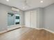 Bright bedroom with hardwood floors, modern ceiling fan, and large closet at 3538 Pecos St, Denver, CO 80211