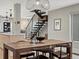 Dining area with contemporary table and chairs, modern lighting, and adjacent staircase at 3538 Pecos St, Denver, CO 80211