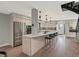 Modern kitchen features a long island with barstool seating and contemporary lighting fixtures at 3538 Pecos St, Denver, CO 80211