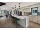 Spacious kitchen island with seating and stainless steel appliances with hardwood flooring at 3538 Pecos St, Denver, CO 80211