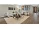 Comfortable living room with modern furniture, large area rug, and decorative artwork at 3538 Pecos St, Denver, CO 80211