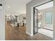 Bright and airy living room featuring hardwood floors, an open floor plan, and a glass-enclosed office at 3538 Pecos St, Denver, CO 80211