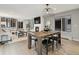 Open concept floor plan features dining, kitchen, and living spaces with hardwood floors at 3538 Pecos St, Denver, CO 80211