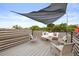 Comfortable rooftop deck with shade, wicker furniture, and decorative pillows for outdoor living at 3538 Pecos St, Denver, CO 80211