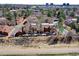 Community aerial view highlighting mature trees, walkways, a community pool, and convenient parking at 2685 S Dayton Way # 141, Denver, CO 80231