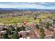 Stunning aerial view of the property near a lush golf course and offering breathtaking mountain views at 2685 S Dayton Way # 141, Denver, CO 80231