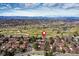 Panoramic aerial shot highlighting the property's prime location near golf courses and surrounded by lush greenery at 2685 S Dayton Way # 141, Denver, CO 80231