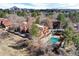 View of townhomes featuring a community pool, pergola, fenced yards and mature landscaping in a well-maintained neighborhood at 2685 S Dayton Way # 141, Denver, CO 80231