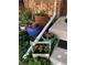 Backyard featuring vibrant flowers in colorful pots, adding a touch of nature at 2685 S Dayton Way # 141, Denver, CO 80231