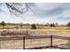 Scenic backyard features a golf course view framed by lush greenery at 2685 S Dayton Way # 141, Denver, CO 80231