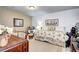 Cozy bedroom featuring a quaint bed and chair, perfect for relaxing after a long day at 2685 S Dayton Way # 141, Denver, CO 80231