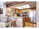 Well-equipped kitchen with stainless steel appliances, granite countertops, and a breakfast bar at 2685 S Dayton Way # 141, Denver, CO 80231