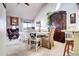 View of the living room and dining area boasting vaulted ceilings and a fireplace at 2685 S Dayton Way # 141, Denver, CO 80231