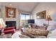Bright living room with a view, fireplace and tv at 2685 S Dayton Way # 141, Denver, CO 80231