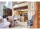 Open-concept living room with a dining area and kitchen features hardwood floors and plenty of natural light at 2685 S Dayton Way # 141, Denver, CO 80231