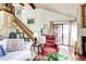 Spacious living room with a vaulted ceiling, fireplace, and sliding door at 2685 S Dayton Way # 141, Denver, CO 80231