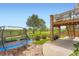 Charming backyard featuring a trampoline and manicured lawn, perfect for outdoor enjoyment at 19431 E Wyoming Ave, Aurora, CO 80017