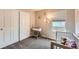 Cozy bedroom with a crib, window with blinds, and a closet with sliding doors at 19431 E Wyoming Ave, Aurora, CO 80017