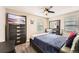 Comfortable bedroom with a bed, dresser, ceiling fan, and window with blinds at 19431 E Wyoming Ave, Aurora, CO 80017