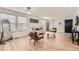 Bright living room with hardwood floors, neutral furniture, and an abundance of natural light at 19431 E Wyoming Ave, Aurora, CO 80017