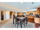 Inviting open-concept living room with dining area and kitchen, perfect for entertaining at 19431 E Wyoming Ave, Aurora, CO 80017