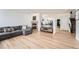 Comfortable living room features a gray couch, fireplace, and wood flooring at 19431 E Wyoming Ave, Aurora, CO 80017