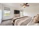 Comfortable main bedroom with ample natural light, neutral tones, and ceiling fan at 19431 E Wyoming Ave, Aurora, CO 80017