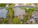 A sprawling home with backyard patio is surrounded by mature trees providing a secluded oasis at 20166 E Shady Ridge Rd, Parker, CO 80134