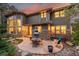 A stunning backyard patio is complete with a stone exterior and outdoor dining set at 20166 E Shady Ridge Rd, Parker, CO 80134