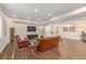Spacious basement living room with hardwood floors and recessed lighting at 20166 E Shady Ridge Rd, Parker, CO 80134