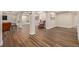 Wide angle shot of a basement with wood floors, recessed lighting, and columns at 20166 E Shady Ridge Rd, Parker, CO 80134