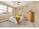 Inviting bedroom with natural light, ceiling fan, and bright, neutral finishes at 20166 E Shady Ridge Rd, Parker, CO 80134