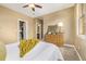 Comfortable bedroom featuring closet and dresser storage and views to the exterior at 20166 E Shady Ridge Rd, Parker, CO 80134