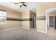 Spacious bedroom with neutral walls, carpet, and a walk-in closet at 20166 E Shady Ridge Rd, Parker, CO 80134