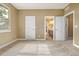 Bedroom with carpet, natural light, and multiple doors for ensuite bathroom access at 20166 E Shady Ridge Rd, Parker, CO 80134