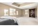 Spacious bedroom with tray ceiling, ample natural light, and large open floor plan at 20166 E Shady Ridge Rd, Parker, CO 80134