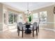 Inviting dining room with ample natural light, modern chandelier, and seating for six at 20166 E Shady Ridge Rd, Parker, CO 80134
