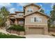 Charming two-story home with stone accents, manicured landscaping, and an attached two-car garage at 20166 E Shady Ridge Rd, Parker, CO 80134