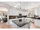 Well-appointed kitchen features a central island and is adjacent to a charming breakfast nook at 20166 E Shady Ridge Rd, Parker, CO 80134