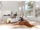 Bright living room featuring a soaring wall of windows and neutral decor, perfect for relaxing and entertaining at 20166 E Shady Ridge Rd, Parker, CO 80134