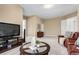 Large living room with carpet, tv and media center and leather chairs, offering plenty of room for relaxation at 20166 E Shady Ridge Rd, Parker, CO 80134