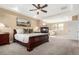Luxurious primary suite featuring a cozy fireplace, sitting area, and abundant natural light at 20166 E Shady Ridge Rd, Parker, CO 80134