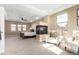 Elegant primary bedroom showcasing a fireplace, seating area, and abundant natural light at 20166 E Shady Ridge Rd, Parker, CO 80134