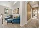 Cozy sitting area with leather chairs, soft carpet, and abundant natural light at 20166 E Shady Ridge Rd, Parker, CO 80134
