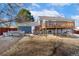 Large backyard with raised garden beds and deck at 5769 S Nepal Ct, Centennial, CO 80015