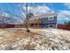 Spacious backyard with mature tree and wooden fence at 5769 S Nepal Ct, Centennial, CO 80015